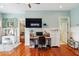 Bright bedroom featuring hardwood floors, desk, and an abundance of storage space at 314 Commonwealth Rd, Mount Pleasant, SC 29466