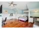 Light-filled bedroom with hardwood floors, ceiling fan, and ample natural light at 314 Commonwealth Rd, Mount Pleasant, SC 29466