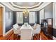 Dining room features a white table, chandelier, hardwood floors, and natural lighting at 314 Commonwealth Rd, Mount Pleasant, SC 29466