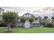 Attractive two-story home with front porch, meticulous landscaping and lush green lawn at 314 Commonwealth Rd, Mount Pleasant, SC 29466