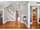 Inviting foyer displaying hardwood floors, staircase, and elegant decor with seamless flow into other spaces at 314 Commonwealth Rd, Mount Pleasant, SC 29466