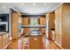 Kitchen features wooden cabinets, granite countertops, and stainless steel appliances at 314 Commonwealth Rd, Mount Pleasant, SC 29466