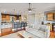Open-concept living room features hardwood floors and seamless transition into the kitchen at 314 Commonwealth Rd, Mount Pleasant, SC 29466