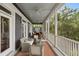 Enjoy the view on this screened porch with comfortable seating and space for entertaining at 314 Commonwealth Rd, Mount Pleasant, SC 29466
