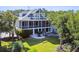 Inviting two-story home with a screened porch, outdoor patio, and a spacious backyard at 314 Commonwealth Rd, Mount Pleasant, SC 29466