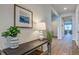 Inviting entryway with a console table, stylish decor, and a view into the living room and other areas, creating a welcoming first impression at 317 Willow Run Dr, Summerville, SC 29486