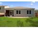 View of backyard featuring green lawn, partial fence, patio, and screened-in porch at 318 Bering Ln, Summerville, SC 29486
