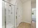 Bathroom featuring a glass-enclosed shower, wood-look flooring, and neutral walls at 318 Bering Ln, Summerville, SC 29486