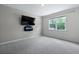 Bedroom with gray carpet, a window, and wall-mounted TV at 318 Bering Ln, Summerville, SC 29486