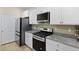 Granite countertops, stainless steel appliances, and ample cabinet space in this kitchen at 318 Bering Ln, Summerville, SC 29486