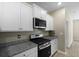 Granite countertops, stainless steel appliances, and ample cabinet space in this kitchen at 318 Bering Ln, Summerville, SC 29486