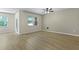 Sun-lit living room with wood floors, ceiling fan, and sliding glass door at 318 Bering Ln, Summerville, SC 29486