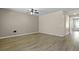 Bright living room features wood floors and ceiling fan at 318 Bering Ln, Summerville, SC 29486