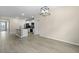 Spacious open-concept living room with hardwood floors, white trim, and neutral paint at 318 Bering Ln, Summerville, SC 29486