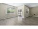 Open-concept living room featuring a window, sliding glass doors and hardwood floors at 318 Bering Ln, Summerville, SC 29486