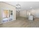 Open-concept living room featuring sliding glass doors, a ceiling fan, and hardwood floors at 318 Bering Ln, Summerville, SC 29486