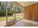 Screened patio with brick flooring and a view of the wooded backyard at 318 Bering Ln, Summerville, SC 29486
