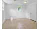 Spacious finished basement with tile floors, natural light, and access door at 323 Millcreek Dr, Charleston, SC 29407