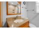 Well-lit bathroom featuring a vanity with a granite countertop and updated fixtures at 323 Millcreek Dr, Charleston, SC 29407