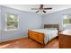 Cozy bedroom featuring a wooden bed frame, wood floors, and natural light at 323 Millcreek Dr, Charleston, SC 29407