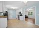 Bright kitchen with stainless steel appliances, tile flooring, and seamless flow to the living area at 323 Millcreek Dr, Charleston, SC 29407