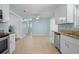 Open concept kitchen with stainless appliances, tile floors, and seamless layout at 323 Millcreek Dr, Charleston, SC 29407