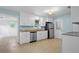 Updated kitchen with white cabinets, stainless steel appliances, and tile flooring at 323 Millcreek Dr, Charleston, SC 29407