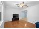 Bright room with hardwood floors, ceiling fan, and a view to another living space at 323 Millcreek Dr, Charleston, SC 29407
