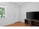 Bright room with hardwood floors, window and a front door. Modern media center at 323 Millcreek Dr, Charleston, SC 29407