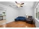 Cozy living room features hardwood floors, ceiling fan, and a comfortable seating area at 323 Millcreek Dr, Charleston, SC 29407