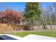 A fenced backyard features mature trees, providing privacy and shade at 350 Arlington Dr, Charleston, SC 29414