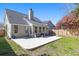 A large backyard features a concrete patio for outdoor living and entertaining at 350 Arlington Dr, Charleston, SC 29414