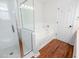 Bright bathroom with glass shower, soaking tub, and classic white subway tile at 350 Arlington Dr, Charleston, SC 29414