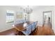 Bright dining room with a chandelier, large table, and blue patterned chairs at 350 Arlington Dr, Charleston, SC 29414