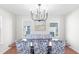 Elegant dining room featuring a chandelier, large table, and blue patterned chairs at 350 Arlington Dr, Charleston, SC 29414