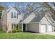 Attractive home exterior with a two-car garage, beautiful lawn and manicured landscaping at 350 Arlington Dr, Charleston, SC 29414