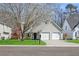 Charming two-story home with a well-manicured lawn, mature tree and a two-car garage at 350 Arlington Dr, Charleston, SC 29414