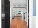 Warm and inviting foyer with hardwood floors, staircase, and view into the living room at 350 Arlington Dr, Charleston, SC 29414