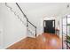 Foyer featuring dark door, staircase, and hardwood floors at 350 Arlington Dr, Charleston, SC 29414