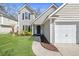 Inviting home exterior featuring well-kept landscaping, a two-car garage and charming front entry at 350 Arlington Dr, Charleston, SC 29414