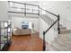 Bright living room with hardwood floors, a staircase, and a cozy fireplace at 350 Arlington Dr, Charleston, SC 29414