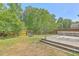 Expansive backyard featuring a wooden deck, fenced perimeter, mature trees, and outdoor space for entertaining at 3661 Locklear Ln, Mount Pleasant, SC 29466