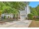 Attractive two-story home with light siding, stone accents, a garage, and a concrete driveway at 3661 Locklear Ln, Mount Pleasant, SC 29466