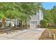 Attractive two-story home with light siding, stone accents, a garage, and a concrete driveway at 3661 Locklear Ln, Mount Pleasant, SC 29466