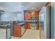 Modern kitchen featuring stainless steel appliances, granite countertops, and warm wood cabinetry at 3661 Locklear Ln, Mount Pleasant, SC 29466
