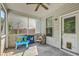 Cozy screened porch with ceiling fan, seating, and an outdoor play area at 3661 Locklear Ln, Mount Pleasant, SC 29466