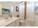 Bright bathroom featuring a white vanity, framed mirror and shower/tub combination at 397 Woodgate Way, Summerville, SC 29485