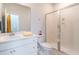 Bright bathroom featuring white vanity, framed mirror and glass shower at 397 Woodgate Way, Summerville, SC 29485