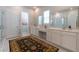 Bright bathroom with double sink vanity, decorative mirrors, and a separate glass shower at 397 Woodgate Way, Summerville, SC 29485