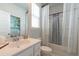 Bright bathroom with white vanity, framed mirror and shower/tub combination at 397 Woodgate Way, Summerville, SC 29485